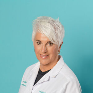 Lasting Impressions spa esthetician in smock located near Gaston lake